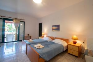 Posteľ alebo postele v izbe v ubytovaní Rivendell Apartments