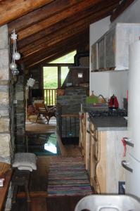 A kitchen or kitchenette at Case Gran Paradiso di Charme Villaggio La Barmaz