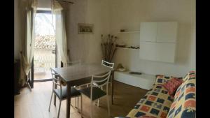 a room with a table and chairs and a couch at Ficarazzi in Morano Calabro