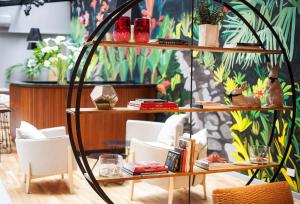 a room with a table with books and chairs at Deco Collection in Buenos Aires