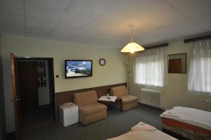 A television and/or entertainment centre at Pension Sparta