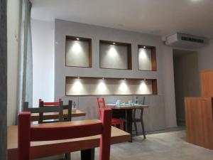 a dining room with a table and chairs at Casa Orrù in Nuoro