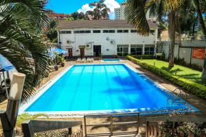 an overhead view of a large blue swimming pool at Hillview Apartments in Kampala
