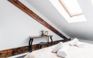 Postel nebo postele na pokoji v ubytování Downtown Bratislava B&B