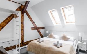 Postel nebo postele na pokoji v ubytování Downtown Bratislava B&B