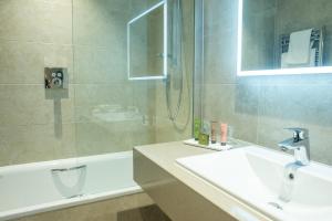 a bathroom with a sink and a shower at Crow Wood Hotel & Spa Resort in Burnley
