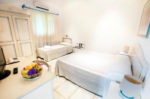 Postel nebo postele na pokoji v ubytování Li Suari Club Village