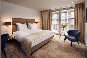 Llit o llits en una habitació de Van der Valk Hotel Mechelen