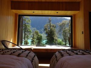 Krevet ili kreveti u jedinici u okviru objekta Lodge Tagua Tagua, Puelo Patagonia