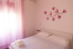 Katil atau katil-katil dalam bilik di Appartamento Velia