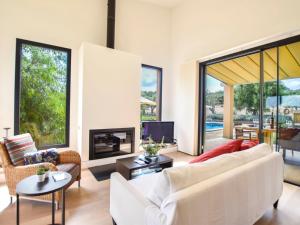 a living room with a white couch and a fireplace at Holiday Home Son Tey by Interhome in Sineu