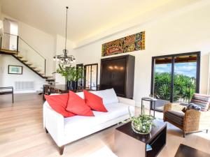 a living room with a white couch and red pillows at Holiday Home Son Tey by Interhome in Sineu +29 photos