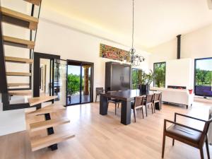 a dining room and living room with a table and chairs at Holiday Home Son Tey by Interhome in Sineu