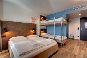 Postel nebo postele na pokoji v ubytování MEININGER Hotel Berlin Tiergarten