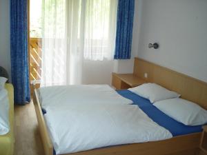 Posteľ alebo postele v izbe v ubytovaní Haus Brunhilde