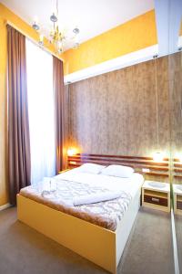 Ένα ή περισσότερα κρεβάτια σε δωμάτιο στο Rustaveli Hotel