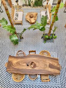 a table with a wooden cutting board on it at Riad Le Pèlerin in Marrakesh