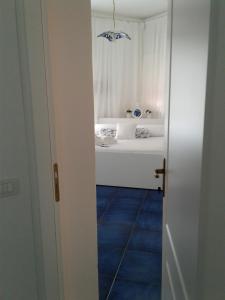 a view of a bedroom with a bed at Casa Blu Cobalto in Maiori +28 photos