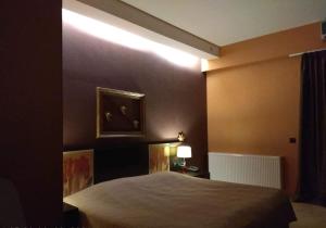 Postel nebo postele na pokoji v ubytování Hotel Cezaria
