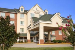 una rappresentazione di un hotel con un edificio di Country Inn & Suites by Radisson, Conway, AR a Conway