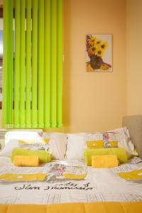 Llit o llits en una habitació de Green Lime Studio