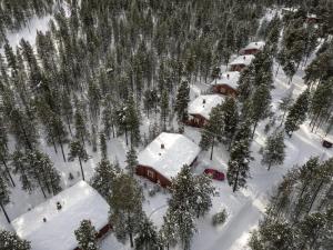 an aerial view of a house covered in snow at Ukonjärven Holiday Village in Ivalo