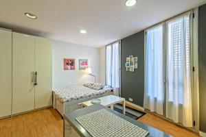 A bed or beds in a room at Loft en Badalona Centro
