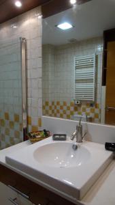 a bathroom with a sink and a mirror at Gaztanbide Apartamento rural in Ochagavía +12 photos