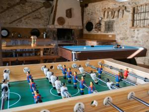 a group of toy people playing a game of billiard at La Fuente in Cubillo