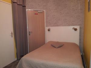 Postel nebo postele na pokoji v ubytování Hotel Le Beauregard