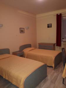 Postel nebo postele na pokoji v ubytování Hotel Le Beauregard