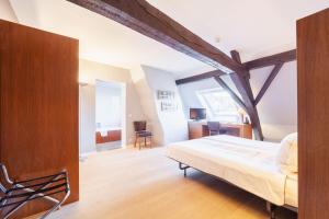 Krevet ili kreveti u jedinici u okviru objekta Hotel Hof van Aragon