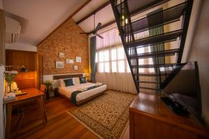 TV a/nebo společenská místnost v ubytování Sweet Cili Boutique Hotel