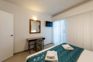 Postel nebo postele na pokoji v ubytování Hotel Galaxias