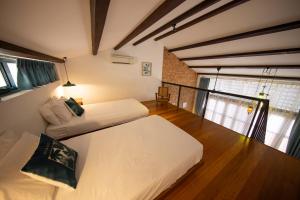 Postel nebo postele na pokoji v ubytování Sweet Cili Boutique Hotel