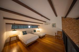 Postel nebo postele na pokoji v ubytování Sweet Cili Boutique Hotel