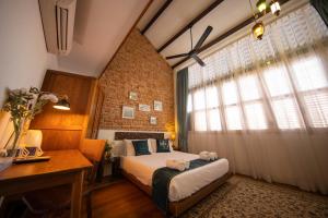 Postel nebo postele na pokoji v ubytování Sweet Cili Boutique Hotel