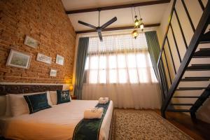 Postel nebo postele na pokoji v ubytování Sweet Cili Boutique Hotel
