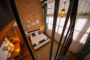 Postel nebo postele na pokoji v ubytování Sweet Cili Boutique Hotel