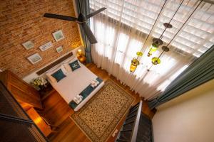 Postel nebo postele na pokoji v ubytování Sweet Cili Boutique Hotel