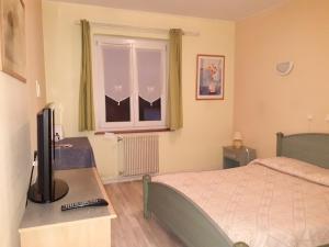 Postel nebo postele na pokoji v ubytování Hotel Le Beauregard