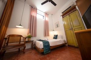 Postel nebo postele na pokoji v ubytování Sweet Cili Boutique Hotel