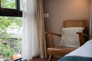 Postel nebo postele na pokoji v ubytování Sweet Cili Boutique Hotel