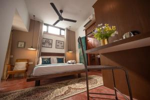 Postel nebo postele na pokoji v ubytování Sweet Cili Boutique Hotel