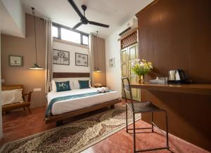 Postel nebo postele na pokoji v ubytování Sweet Cili Boutique Hotel