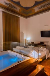 A bed or beds in a room at Naca Suite