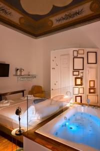 A bed or beds in a room at Naca Suite