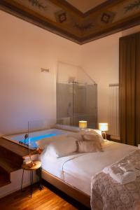 A bed or beds in a room at Naca Suite