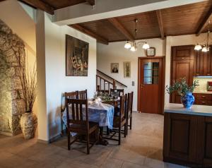 a dining room with a table and chairs at Cassiopeia's Castle in Gythio