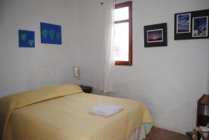 Voodi või voodid majutusasutuse Hostal Galapagos by Bar de Beto toas